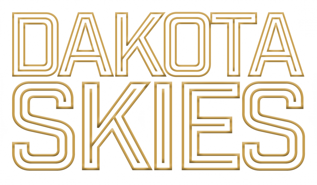 Text reading 'DAKOTA SKIES' in bold, stylized gold outlined letters on a transparent background.